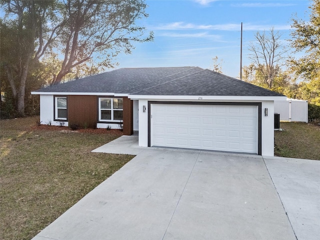 single story home featuring a garage, a shingled roof, concrete driveway, a front yard, and stucco siding