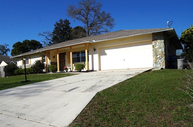 ranch-style home with a garage, concrete driveway, stone siding, stucco siding, and a front yard