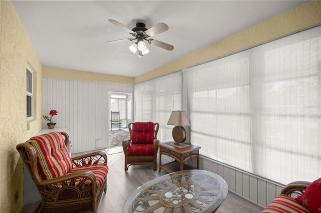 sunroom / solarium with ceiling fan