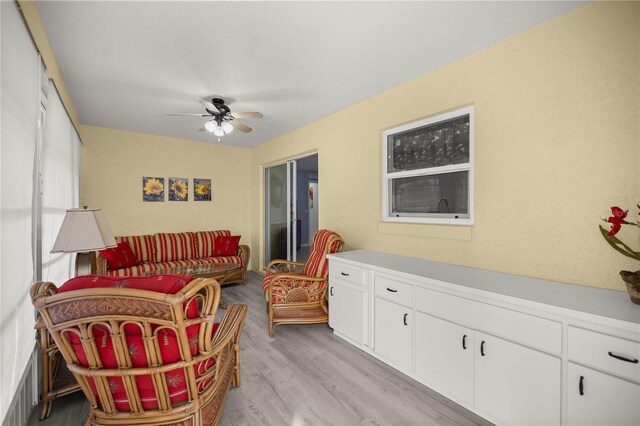 interior space with light wood-style flooring and a ceiling fan