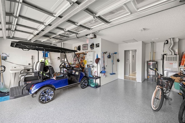 garage with a garage door opener and water heater