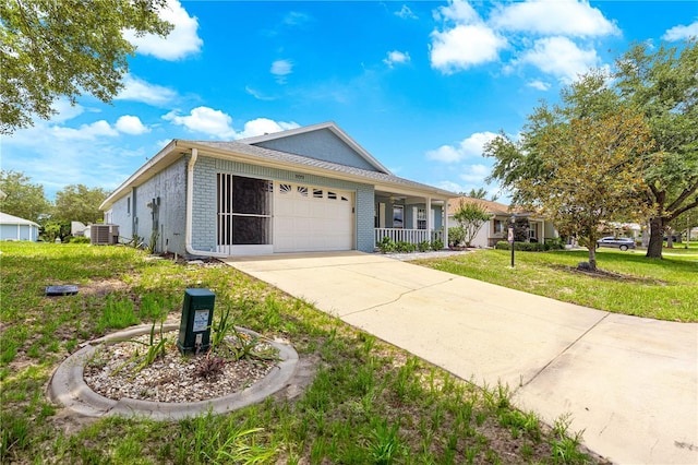 9770 SW 97th Pl, Ocala, FL 34481 - ranch-style home featuring an attached garage, concrete driveway, brick siding, and central air condition unit