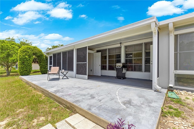 9770 SW 97th Pl, Ocala, FL 34481 - back of property featuring a patio and a sunroom