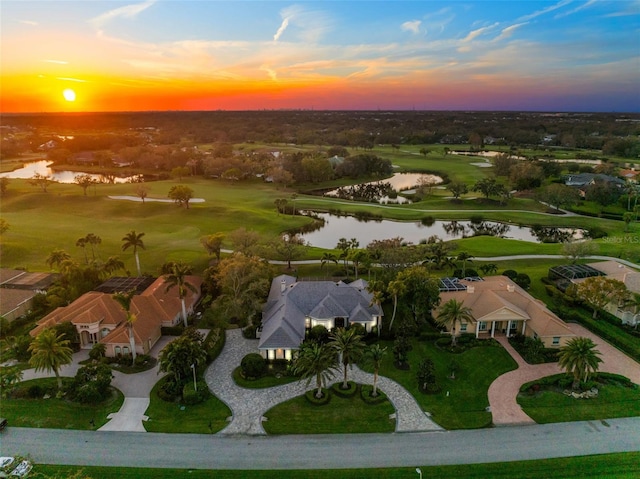 aerial view with view of golf course and a water view