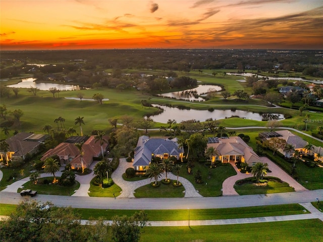 bird's eye view featuring a water view and golf course view