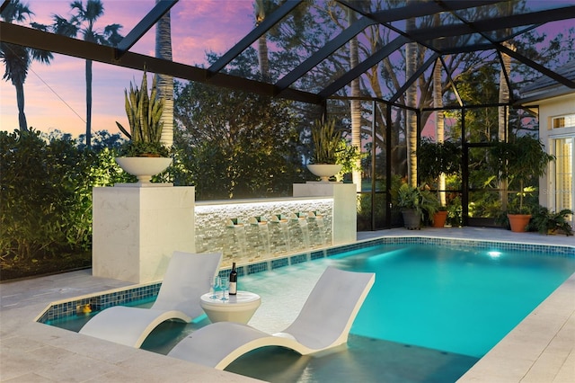 pool featuring a lanai and a patio