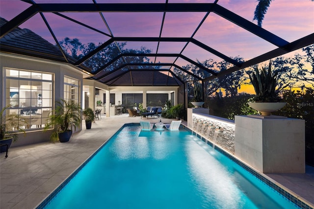 pool featuring a lanai and a patio