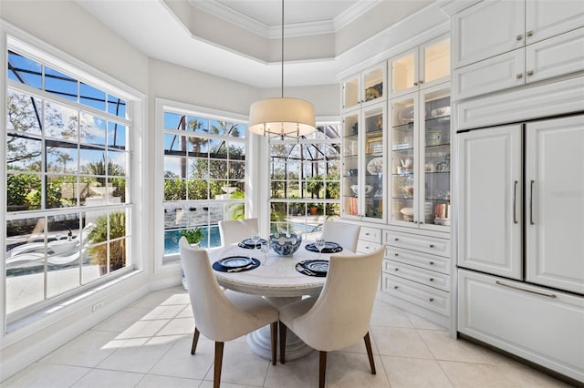 sunroom / solarium with a raised ceiling and a healthy amount of sunlight