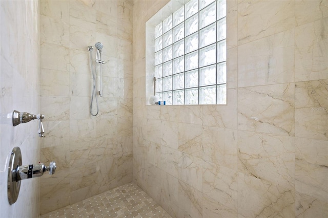 bathroom with tiled shower