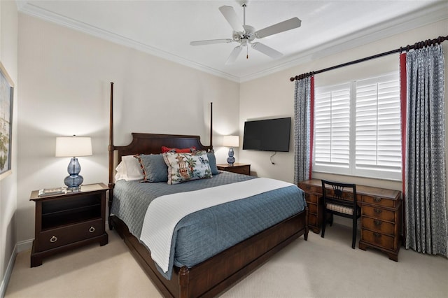 bedroom featuring ceiling fan, ornamental molding, and carpet flooring