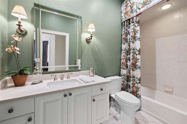 bathroom featuring shower / tub combo with curtain, vanity, toilet, and tile patterned floors