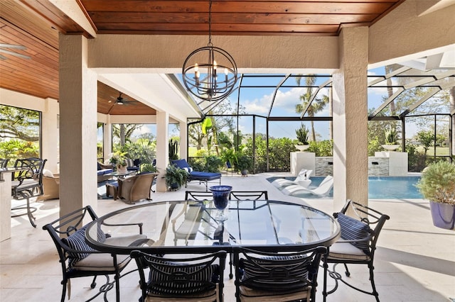 view of patio with outdoor dining space, an outdoor pool, glass enclosure, and ceiling fan