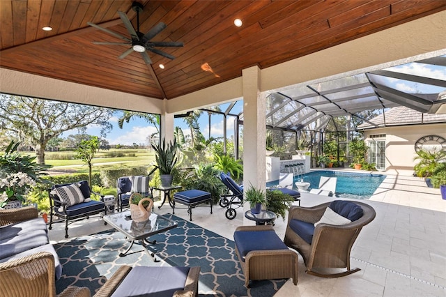 view of patio featuring an outdoor pool, a ceiling fan, a lanai, a gazebo, and an outdoor living space