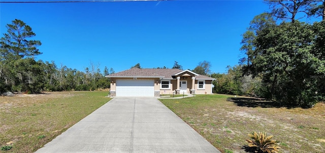 view of front of home featuring a front lawn, a garage, driveway, and stucco siding