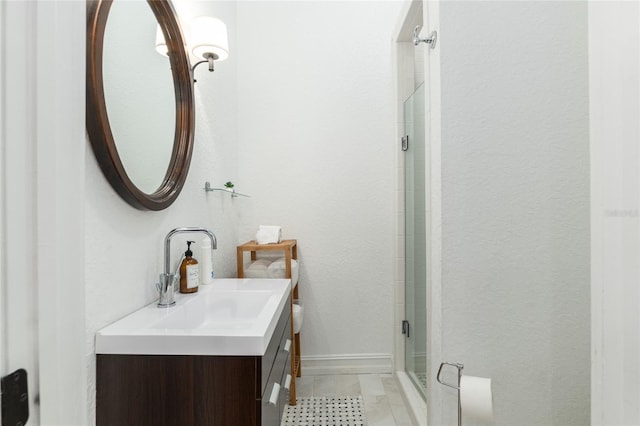 full bath with a stall shower and vanity