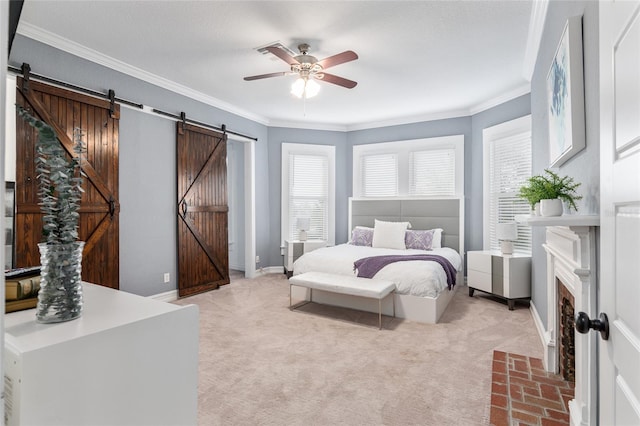 bedroom with a barn door, baseboards, crown molding, and light colored carpet
