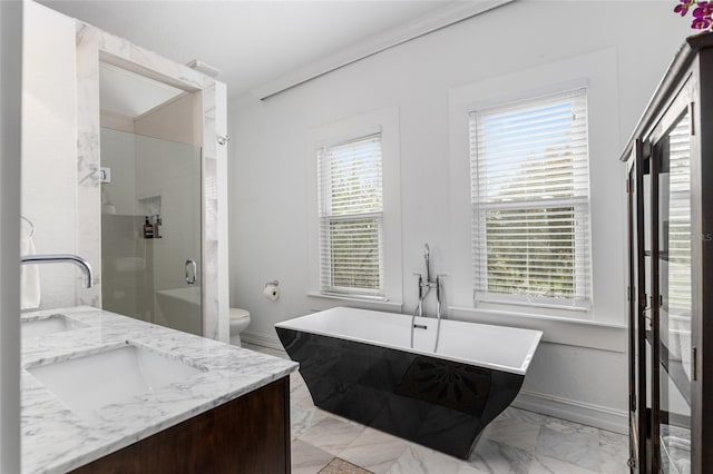 full bath featuring marble finish floor, a stall shower, vanity, and a wealth of natural light
