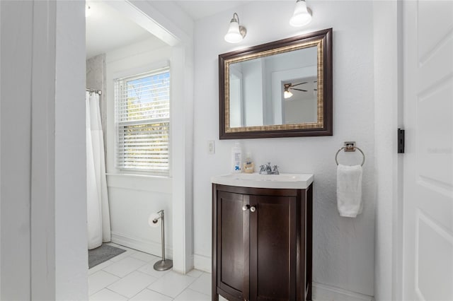bathroom with baseboards and vanity