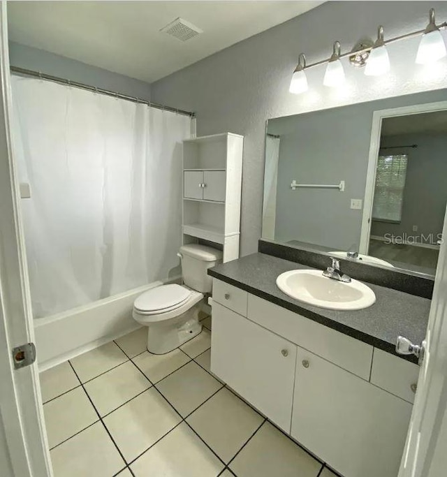 bathroom with tile patterned floors, visible vents, shower / bathtub combination with curtain, toilet, and vanity