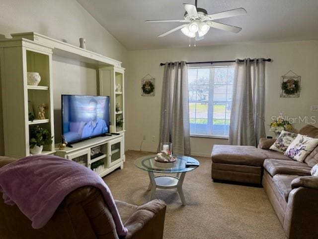 carpeted living room featuring lofted ceiling and a ceiling fan