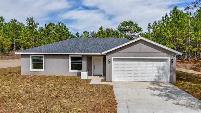 single story home featuring stucco siding, driveway, a shingled roof, and a garage