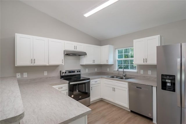 kitchen featuring appliances with stainless steel finishes, light countertops, under cabinet range hood, white cabinetry, and a sink