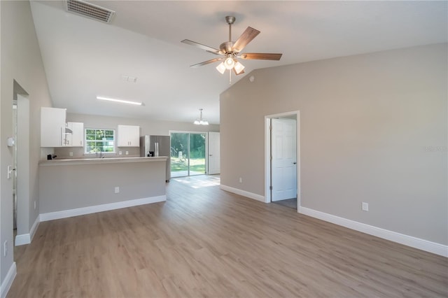 unfurnished living room featuring visible vents, baseboards, ceiling fan, vaulted ceiling, and light wood-style floors