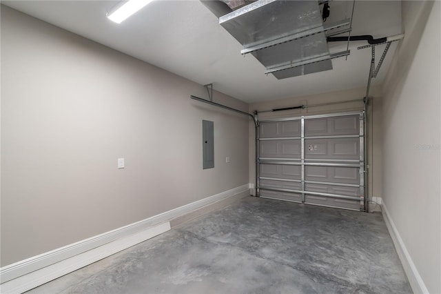 garage featuring electric panel and baseboards