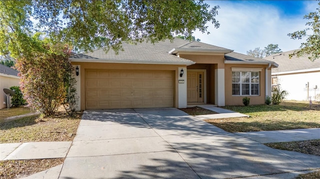 ranch-style house featuring concrete driveway, an attached garage, a front yard, and stucco siding