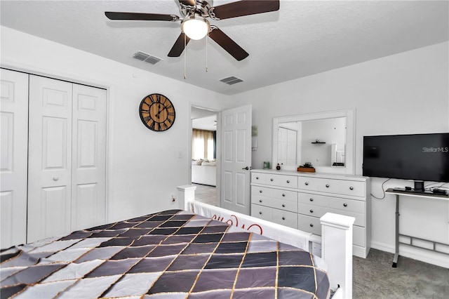 bedroom with visible vents, carpet, a closet, and ceiling fan