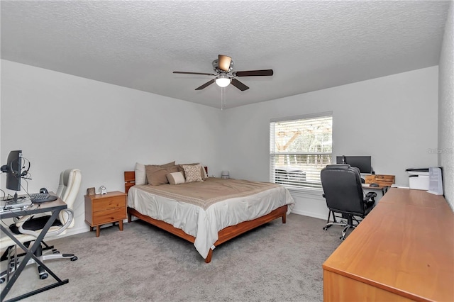 bedroom with ceiling fan, light colored carpet, and a textured ceiling