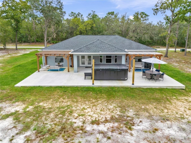 back of house with a patio, a yard, french doors, roof with shingles, and outdoor lounge area