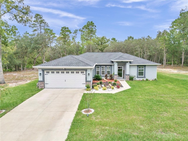 view of front of property with stucco siding, driveway, stone siding, an attached garage, and a front yard