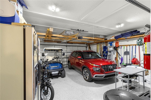 garage with white refrigerator with ice dispenser and a garage door opener