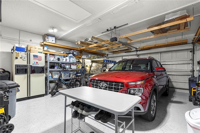 garage with white fridge with ice dispenser and a garage door opener