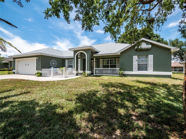 ranch-style house with covered porch, a garage, concrete driveway, stucco siding, and a front lawn