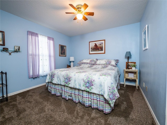 bedroom featuring carpet floors, a ceiling fan, baseboards, and a textured ceiling