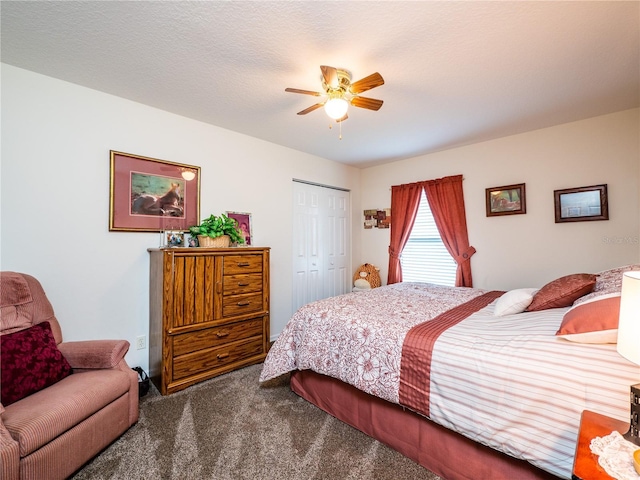 bedroom featuring ceiling fan, a closet, carpet flooring, and a textured ceiling