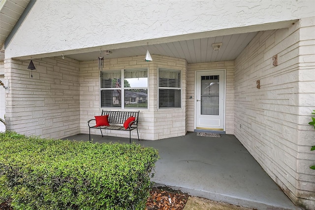 doorway to property featuring covered porch