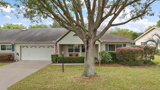 ranch-style house with concrete driveway, a front lawn, and an attached garage