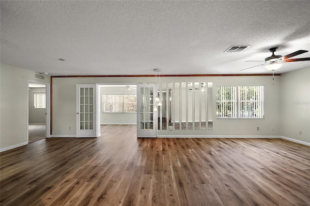 9025 SW 94th Ln Unit C, Ocala, FL 34481 - spare room featuring visible vents, baseboards, wood finished floors, and ceiling fan