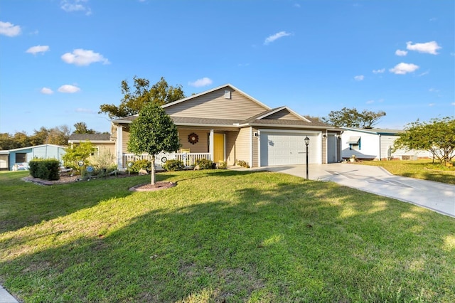 ranch-style home with a garage, covered porch, concrete driveway, and a front yard