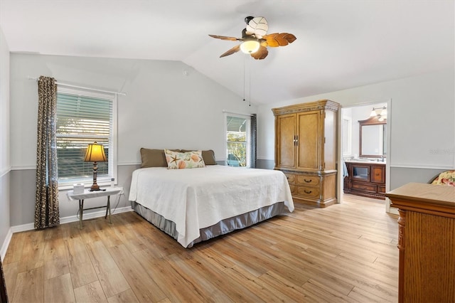 bedroom featuring light wood-type flooring, ceiling fan, lofted ceiling, and baseboards