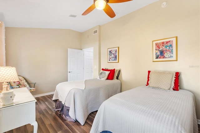 bedroom with visible vents, a ceiling fan, vaulted ceiling, wood finished floors, and baseboards