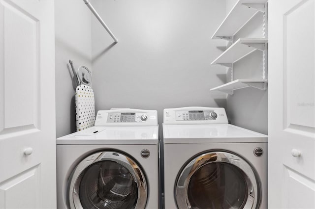 washroom featuring laundry area and independent washer and dryer