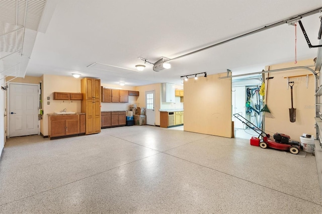 garage featuring a sink and a garage door opener