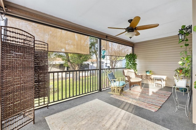 sunroom featuring a ceiling fan