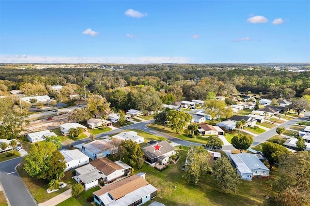 bird's eye view featuring a residential view and a view of trees