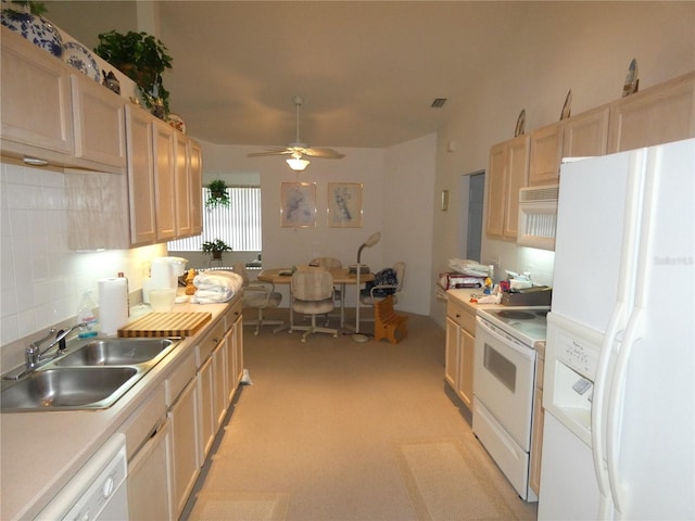 kitchen featuring ceiling fan, white appliances, a sink, light countertops, and tasteful backsplash