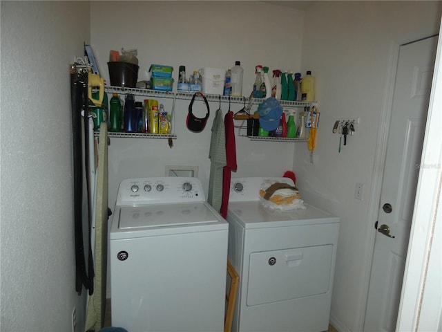 washroom featuring laundry area and washer and dryer